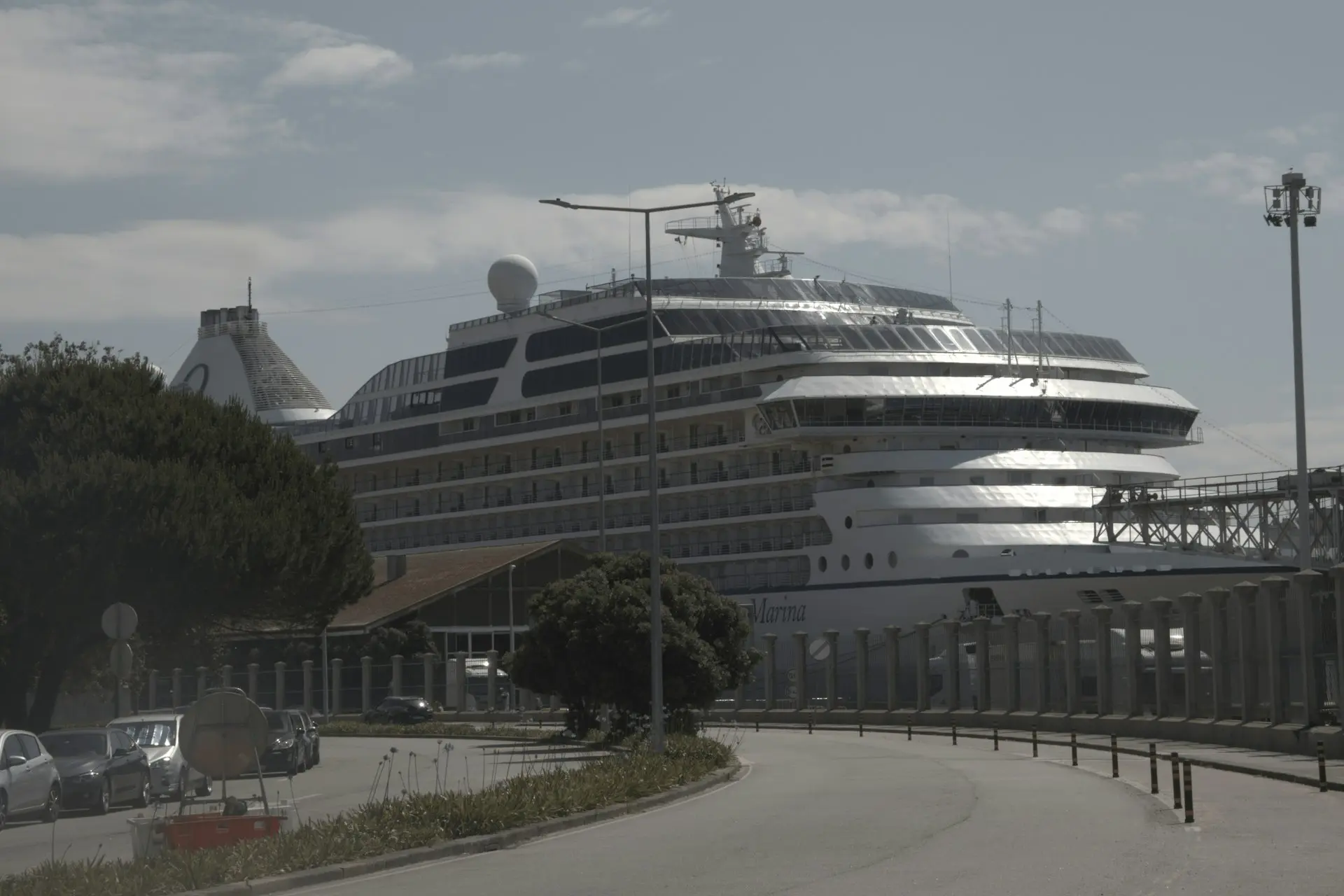 A large cruise ship docked in a harbor